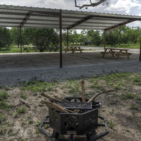 Outdoor seating under pavilion and fire pit